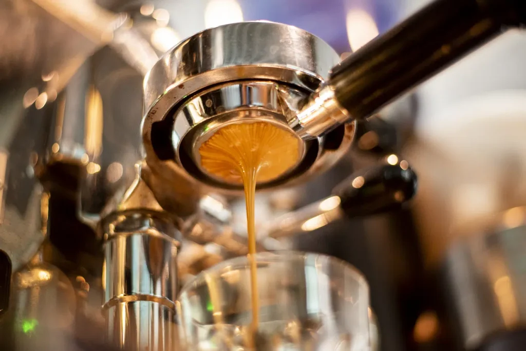 close up coffee machine is preparing coffee coffee shop